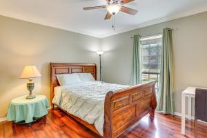 a bedroom with a bed and a ceiling fan at Houston Home with Screened Porch, Near Sugar Land! in Houston