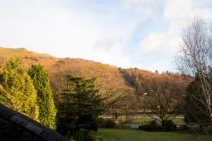 a view of a mountain from a yard at The Wordsworth, Grasmere - The Inn Collection Group in Grasmere