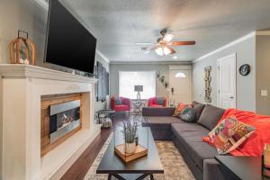 a living room with a couch and a fireplace at ROYAL LANDING 3BD MTB Friendly in Bentonville