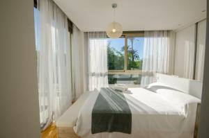 Ένα ή περισσότερα κρεβάτια σε δωμάτιο στο VILLA PARADISE BEACH +26 φωτογραφίες