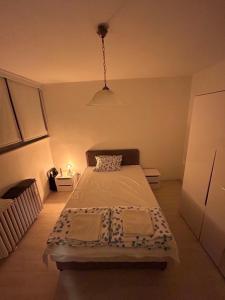 a small bedroom with a bed in a room at Aki Apartment in Zagreb