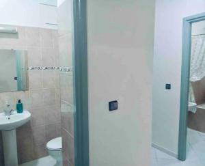 a bathroom with a shower and a toilet and a sink at the best appartement in Taza