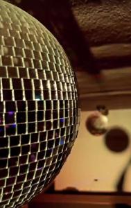a close up of a disco ball hanging from a ceiling at Day Off Club in Skopje