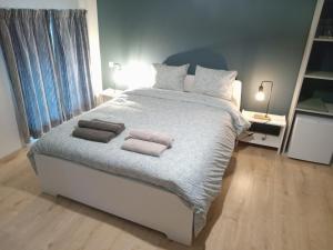 מיטה או מיטות בחדר ב-Le Vieux Noyer