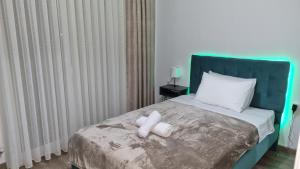 a bed with two rolls of toilet paper on it at Luxury Apartment Serenity in Alexandroupoli +13 photos