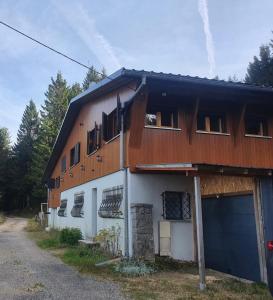 a building with a lot of windows on it at Chalet ALOA in Le Bonhomme