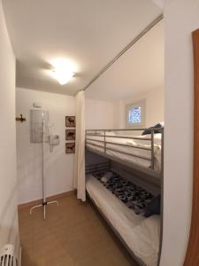 a small room with two bunk beds in it at Bed and Snow Ski in Sierra Nevada
