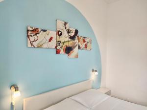 Postel nebo postele na pokoji v ubytování Gardenia Rooms