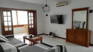 a living room with a couch and a table at CASA GUELDE in Tías