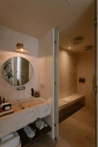 a bathroom with a sink and a mirror at Hotel Sureño Yucatan in Mérida +37 photos