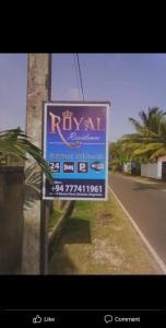 a sign on the side of a road at Royal Residence Negombo in Negombo