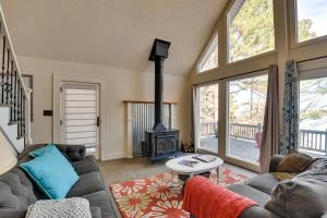 a living room with a couch and a stove at Buckhead Home with On-Site Lake Oconee Access! in Eatonton 