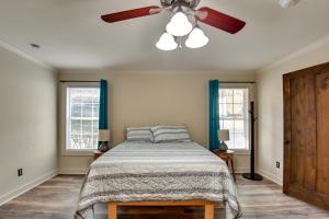 a bedroom with a bed and a ceiling fan at Buckhead Home with On-Site Lake Oconee Access! in Eatonton 