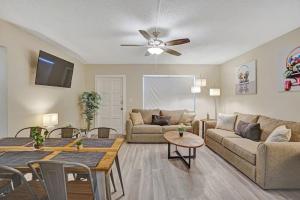a living room with a couch and a table at The Oceans Cozy 2BR Apartment in Victoria Park in Fort Lauderdale