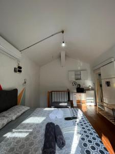 a bedroom with a bed and a living room at Cinar Apart in Istanbul