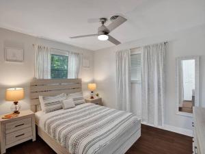 a bedroom with a bed and a ceiling fan at Poolside Paradise Spacious 3BR Haven near Pompano Beach in Pompano Beach