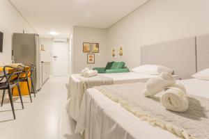 Een bed of bedden in een kamer bij Studio Itapema a 230m da Passarela na Barra WV4437