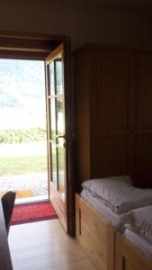 Posteľ alebo postele v izbe v ubytovaní B&B Rendena Chalet