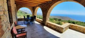 a balcony of a house with a view of the ocean at Villa Seaview in Oitylo +5 photos