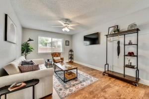 a living room with a couch and a ceiling fan at Near Downtown Dallas - The Dapper Charm in Dallas