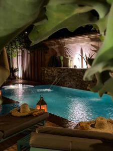 a swimming pool at a resort at night at Villa Taj Sofia & Spa in Marrakesh