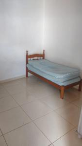 Ένα ή περισσότερα κρεβάτια σε δωμάτιο στο Área de lazer Nossa Senhora Aparecida