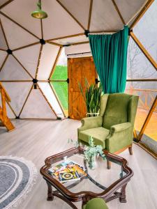 a room with a chair and a table in a yurt at Astral WORLD in Sapanca