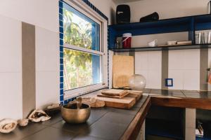 a kitchen with a counter top with a window at BIG SOTO HAUS in Totoralillo