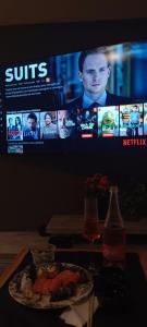 Et tv og/eller underholdning på Apartamento Central em Canela