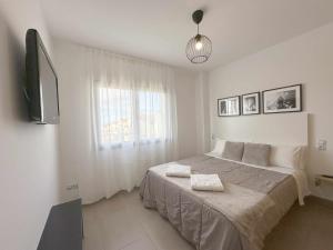 Ein Bett oder Betten in einem Zimmer der Unterkunft Casa Jimena