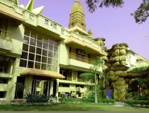 a building with a tower on top of it at Ananda Krishna Van in Vrindāvan