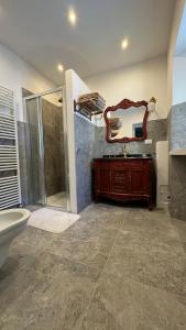 a bathroom with a sink and a mirror at Casa Vettori in San Niccolò Comèlico