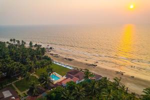an aerial view of the beach at sunset at La Cabana Beach & Spa, By Ashvem Beach in Mandrem