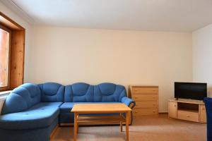 Televízia a/alebo spoločenská miestnosť v ubytovaní Hotel Eufória