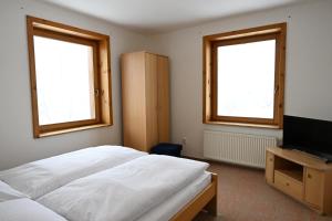 Televízia a/alebo spoločenská miestnosť v ubytovaní Hotel Eufória