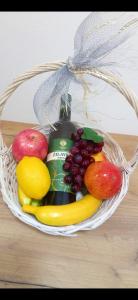 a basket filled with fruit and a bottle of drink at STAN NA DAN BIJELJINA in Bijeljina