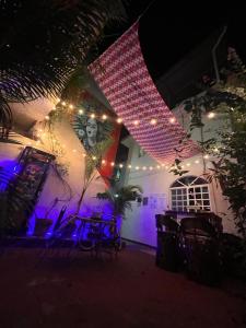 a group of chairs and lights on a building at Hotel Familiar El Dorado in Zihuatanejo