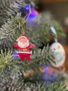 a christmas tree with a santa claus ornament at Hotel Aksaray in Istanbul