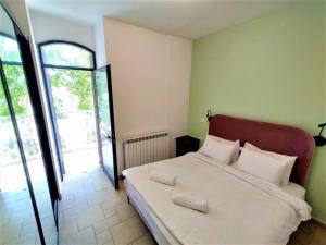 a bedroom with a large bed with white pillows at Family Apartment near Old City in Jerusalem