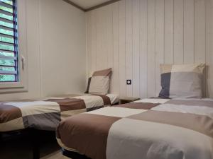 Postel nebo postele na pokoji v ubytování Chalet Etxetxoa, de 1 à 4 personnes avec Climatisation, SPA, Terrain privé et Piscine