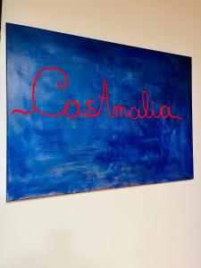 uma pintura da palavra porque amnell em uma parede em CasAmalia em Florença