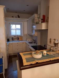 a kitchen with a table with a plate on it at Ferienhaus am Mondsee in Mondsee