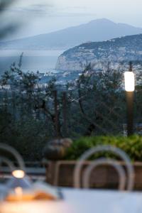 a view of a table with a view of the ocean at Holidays Homes The dream in Sant'Agnello