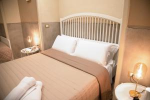 Postel nebo postele na pokoji v ubytování Graziano Home Station