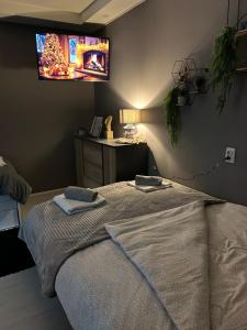 A bed or beds in a room at Beta House Apartments
