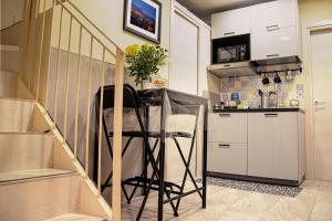 Kuchyň nebo kuchyňský kout v ubytování Graziano Home Station + 26 fotografií