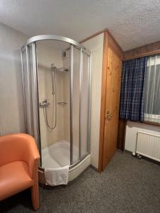 a shower with a glass enclosure in a room at Romantic Room with private bathroom in Saas