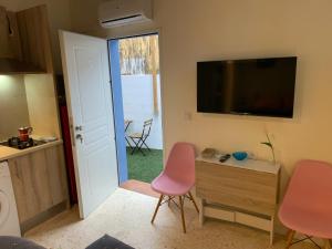 TV a/nebo společenská místnost v ubytování Centauro