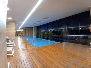 a large swimming pool in the middle of a building at Bespoke Suite, Unique Location, Complementary Airport Pick Up in Bogotá
