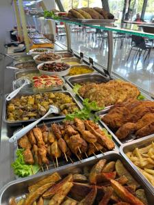 a buffet line with many different types of food at Hotel Nirvana in Tbilisi City